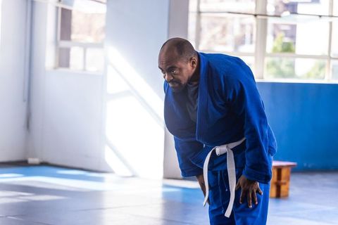 Martial arts practitioner showing respect in training facility