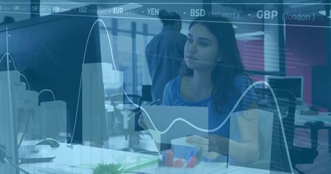 Woman Analyzing Financial Charts in Modern Office