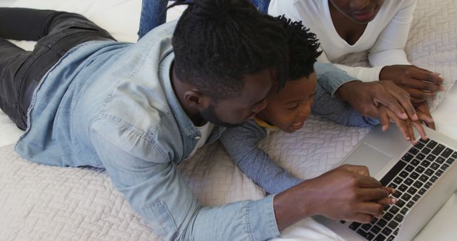 Happy African American Family Bonding with Laptop at Home - Download Free Stock Images Pikwizard.com