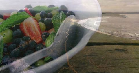 Organic fruit bowl overlooking coastal scenery