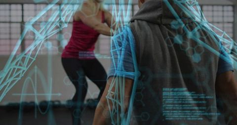 Fitness trainer monitoring woman lunging with augmented reality performance overlay