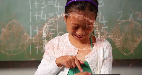 Elementary student tapping tablet in classroom learning math with digital network overlay