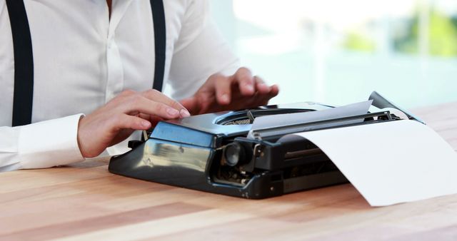 A person is typing on a vintage typewriter, with copy space - Download Free Stock Photos Pikwizard.com