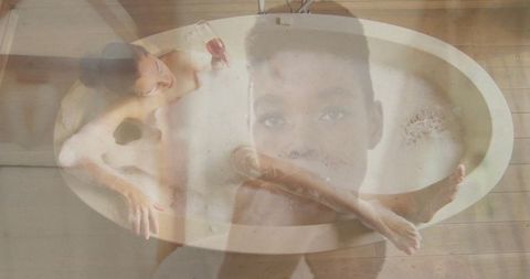 Woman Relaxing in Bathtub with Wine and Artistic Double Exposure Effect