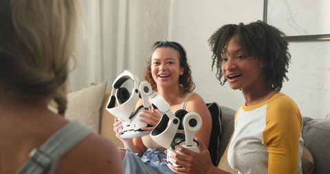 Diverse Friends Testing VR Headsets in Modern Living Room
