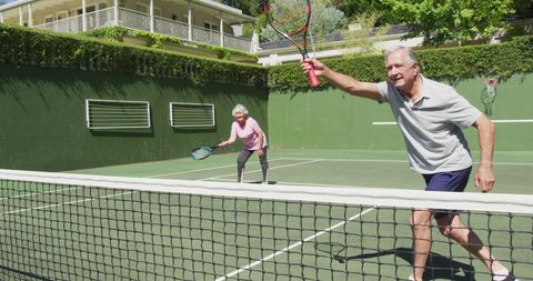 Senior Couple Enjoying Outdoor Tennis Game - Download Free Stock Images Pikwizard.com