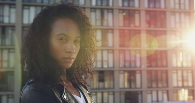 Confident African American Woman Outdoors in Urban Setting with Lens Flare Lighting - Download Free Stock Images Pikwizard.com