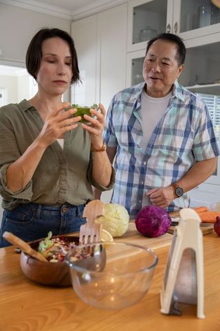 Diverse Couple Cooking Together in Home Kitchen