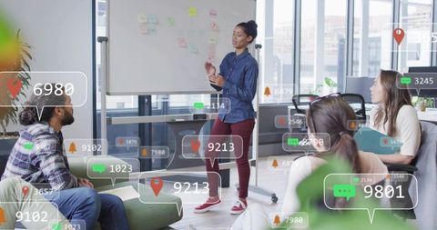 Female presenter leading ar-enhanced brainstorming session in modern urban workspace