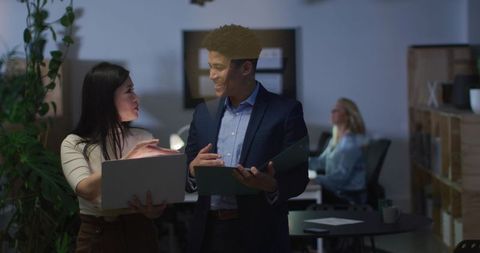 Diverse Professionals Collaborating on Business Project in Modern Office