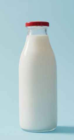 vintage milk bottle on minimalist blue background - Download Free Stock Images Pikwizard.com