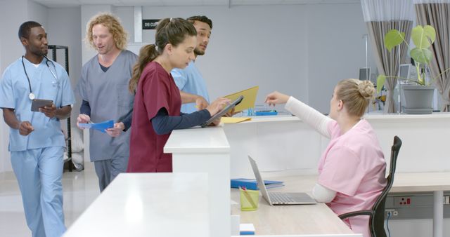 Healthcare Team Collaborating in Hospital Reception - Download Free Stock Images Pikwizard.com