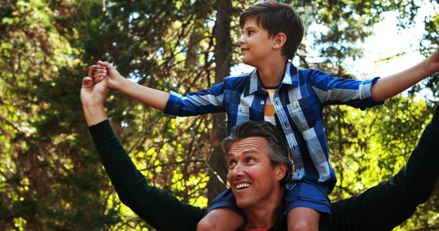 Father Carrying Son on Shoulders in Forest - Download Free Stock Images Pikwizard.com