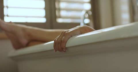 Relaxing moment in bathtub with natural light