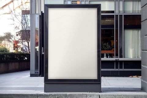 Blank outdoor advertising sign on urban sidewalk