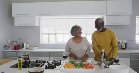 Senior African Couple Cooking Together in Modern Kitchen - Download Free Stock Images Pikwizard.com