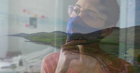 Pensive Woman Overlooking Scenic Coastal Hills in Mask
