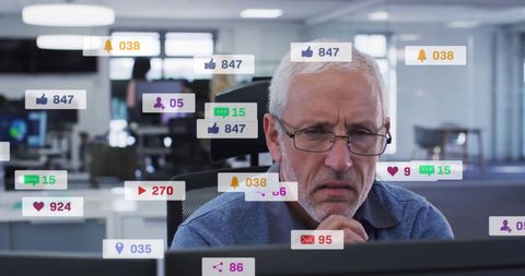 Focused elderly man surrounded by digital social media notifications