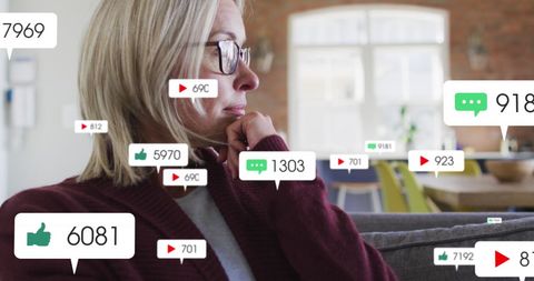 Mature Woman Engaged with Social Media at Home, Monitoring Feedback