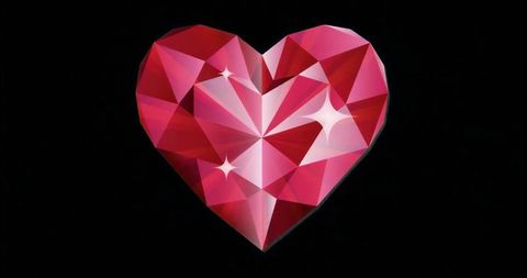 Heart-shaped gemstone reflecting red and pink facets