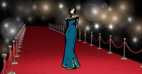 Stylish woman in blue gown gracefully on red carpet