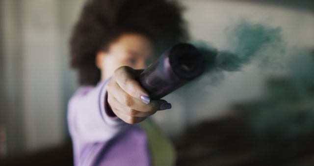 Woman Holding Smoke Device with Outstretched Arm - Download Free Stock Images Pikwizard.com