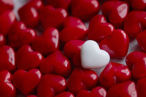 Red and white heart-shaped candies symbolizing love and uniqueness