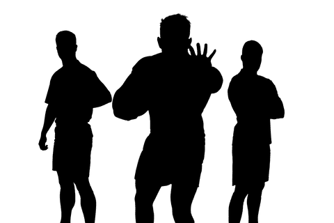 Silhouettes of male footballers on transparent background