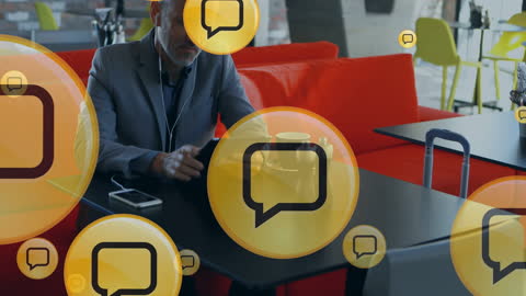 Businessman Engaging with Social Media Icons in Modern Cafe