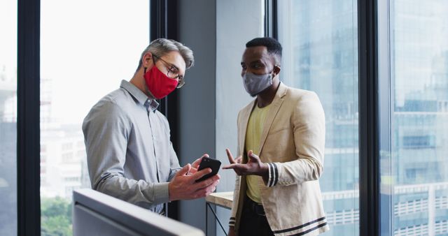 Masked Colleagues Discussing Project in Modern Office - Download Free Stock Images Pikwizard.com