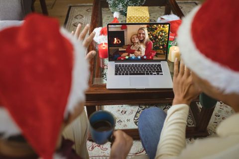 Multicultural Couple Video Calling Family on Christmas