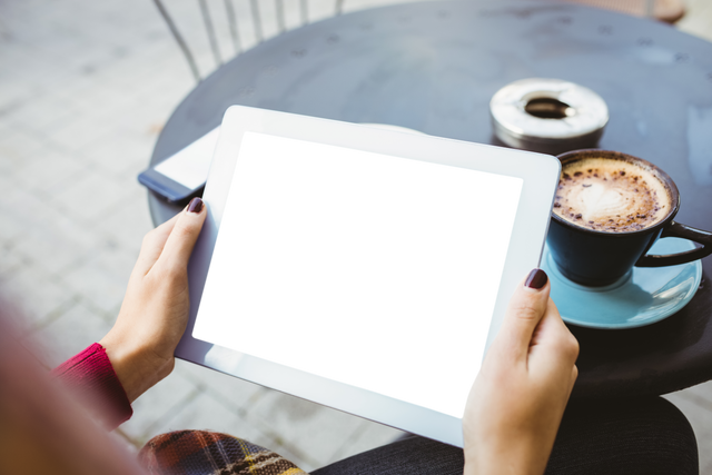 Transparent Digital Tablet on Cafe Table with Coffee Cup - Download Free Stock Videos Pikwizard.com