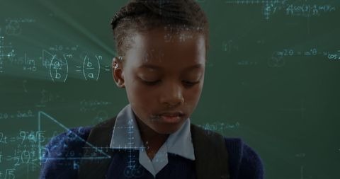 Schoolgirl Immersed in Mathematical Formulae Against Chalkboard
