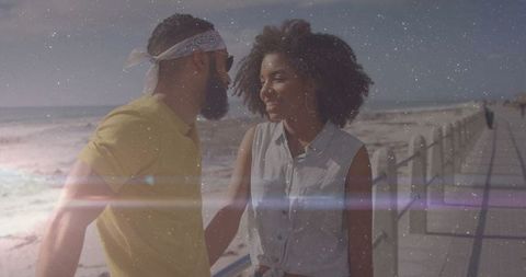 Happy Couple Enjoying Stroll by Ocean