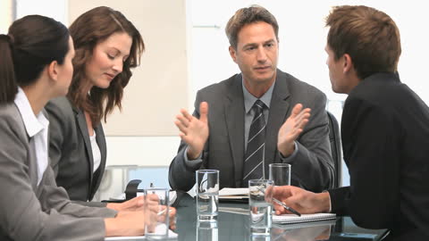 Executives Engaged in Productive Business Meeting Discussion