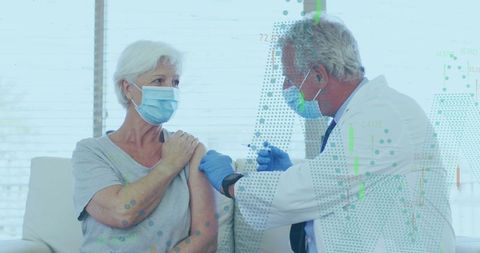 Senior woman receiving vaccine from medical professional at clinic