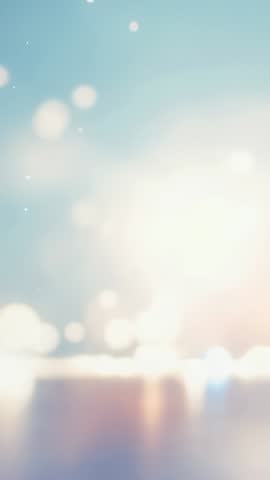 Vertical Video Drifting Bokeh Orbs Over Sky Blue Gradient Merging with Golden Glow