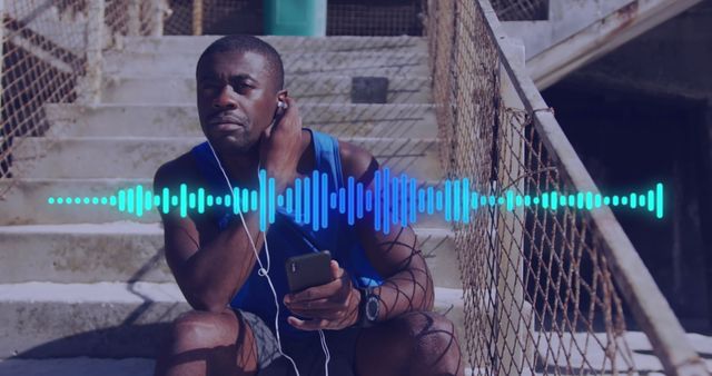 Fitness Enthusiast on Break Enjoying Music Outdoors - Download Free Stock Images Pikwizard.com