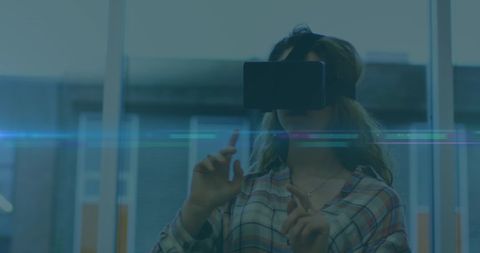 Woman Experiencing Virtual Reality in Futuristic Office Environment