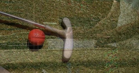 Putter Head and Red Golf Ball on Green with Overlay Grids