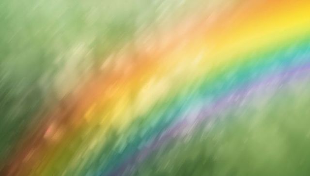 Diagonal rainbow motion blur across soft green bokeh background for abstract design