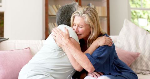 Two Senior Friends Embracing in Comfort and Support
