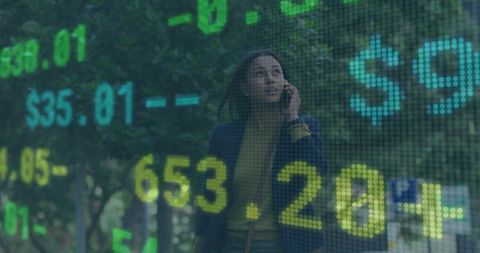 Businesswoman Analyzing Stock Data Overlay While Walking in Urban Area