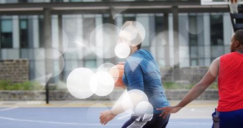 Intense Outdoor Basketball Game with Athletic Players