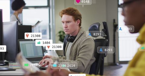 Man engaging with social media analytics in office