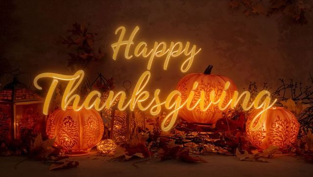 Happy Thanksgiving Neon Script Glowing Over Carved Pumpkins on Autumn Mantel