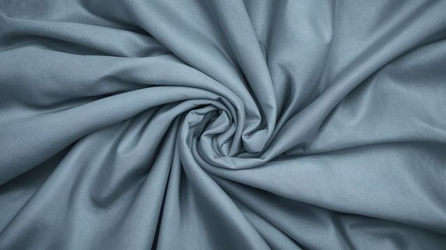 Elegant spiral pattern on light blue fabric