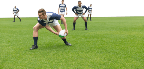 Transparent male rugby players in active position on field