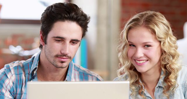 Young Professionals Working Together on Laptop in Office - Download Free Stock Images Pikwizard.com