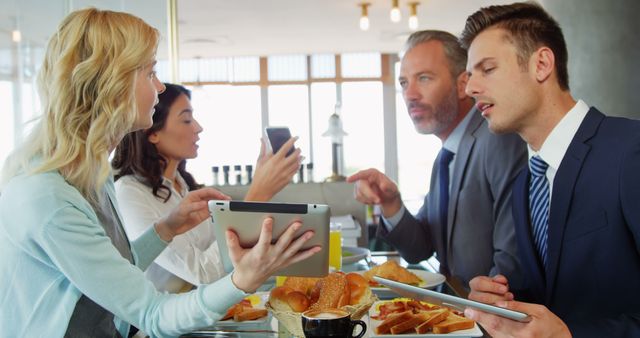 Business Team Discussing Work over Breakfast - Download Free Stock Images Pikwizard.com